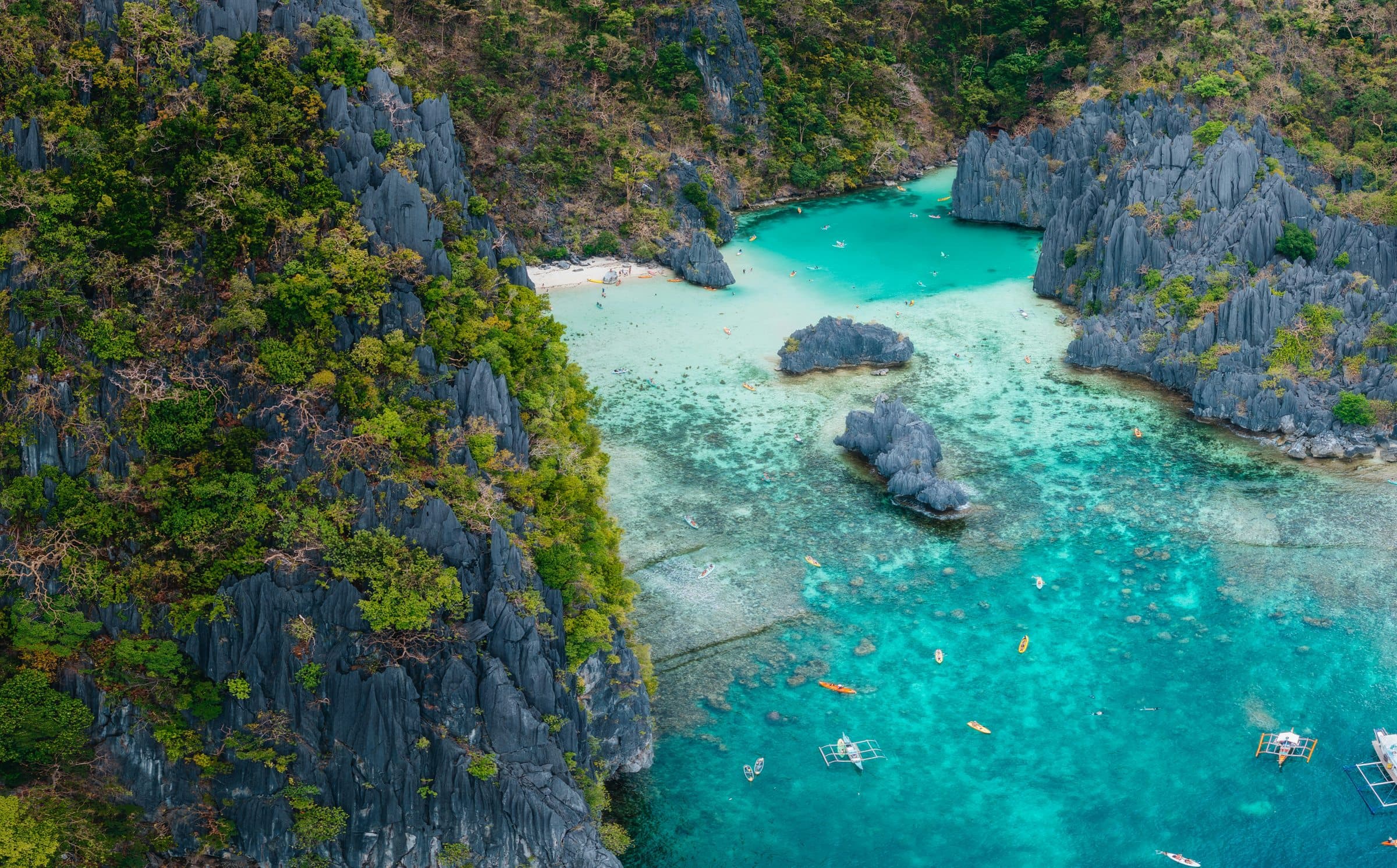 Aerial view of Palawan limestone cliffs and turquoise lagoon